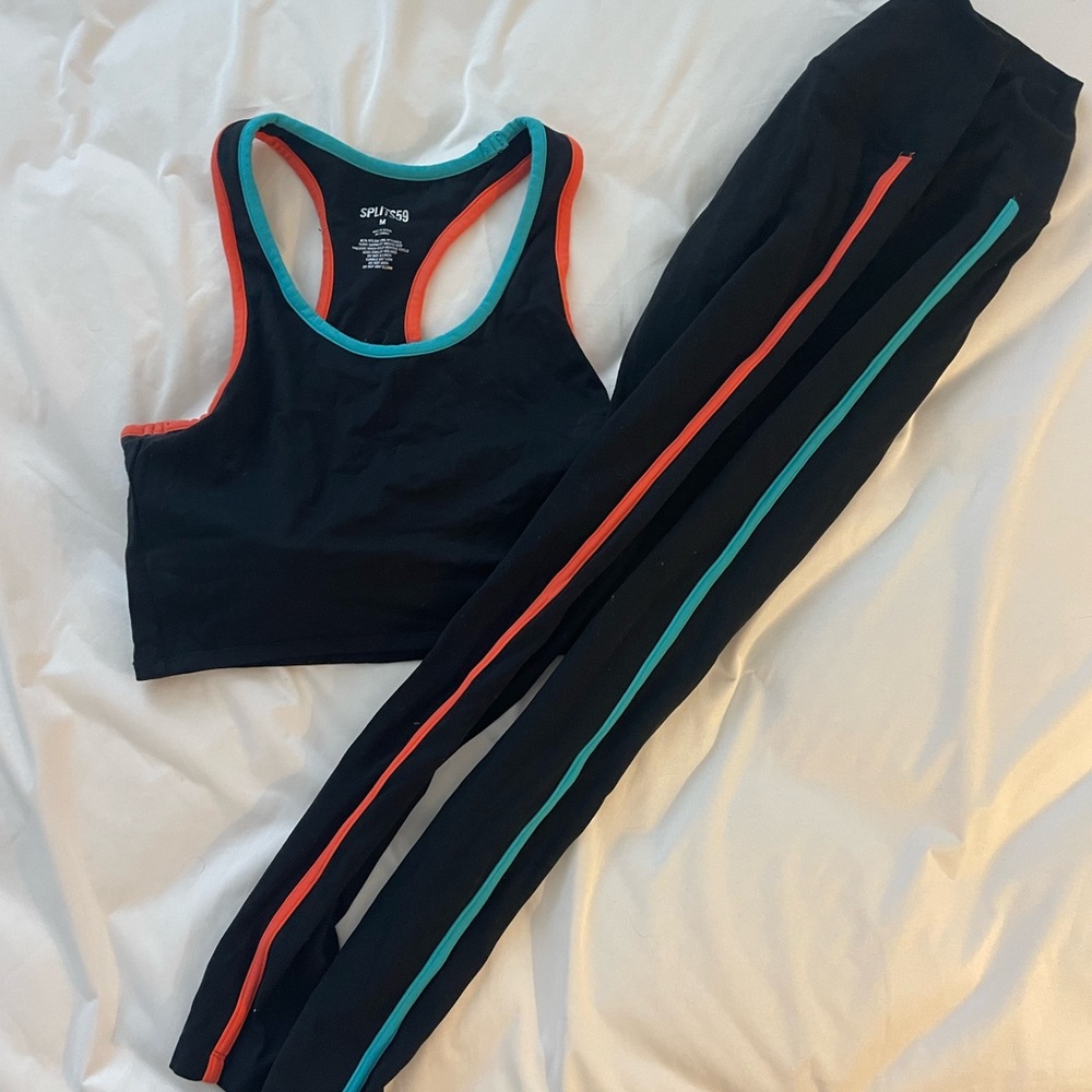 Splits59 Black Sports Bra with orange and Blue Trim